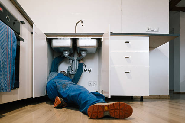 Professional Drain Cleaning technician working in Justice, OK